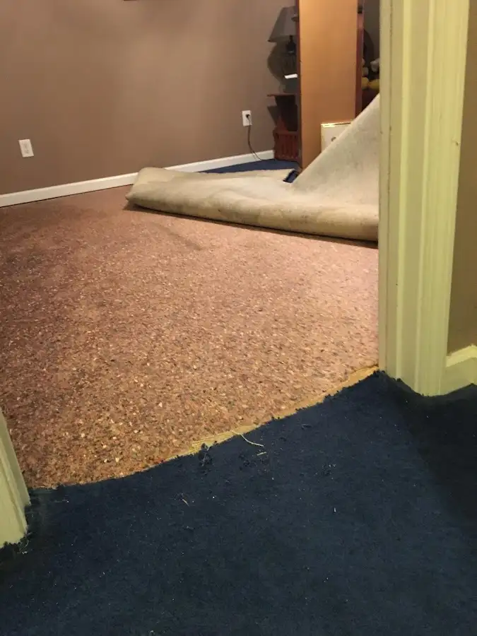 Carpet pad removal revealing water damage during Drying & Dehumidification in Overland